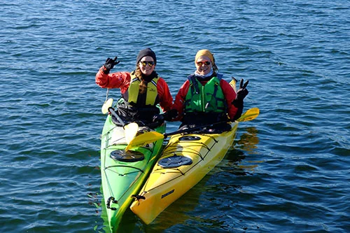 Sara and Andi having fun in their kayaks